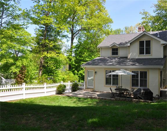 67 Brook Street Wellesley, MA 02482 - Photo 13 of 14 a front view of a house with a garden