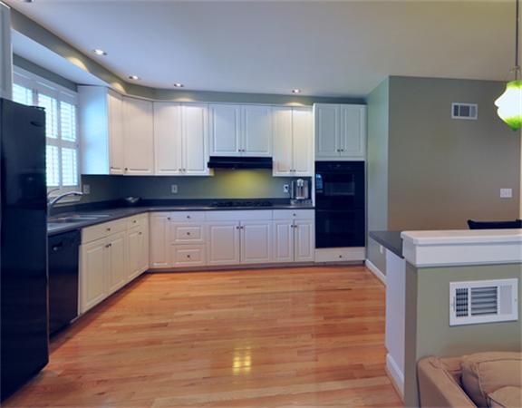 67 Brook Street Wellesley, MA 02482 - Photo 3 of 14 a large kitchen with granite countertop a stove top oven a sink dishwasher and a refrigerator