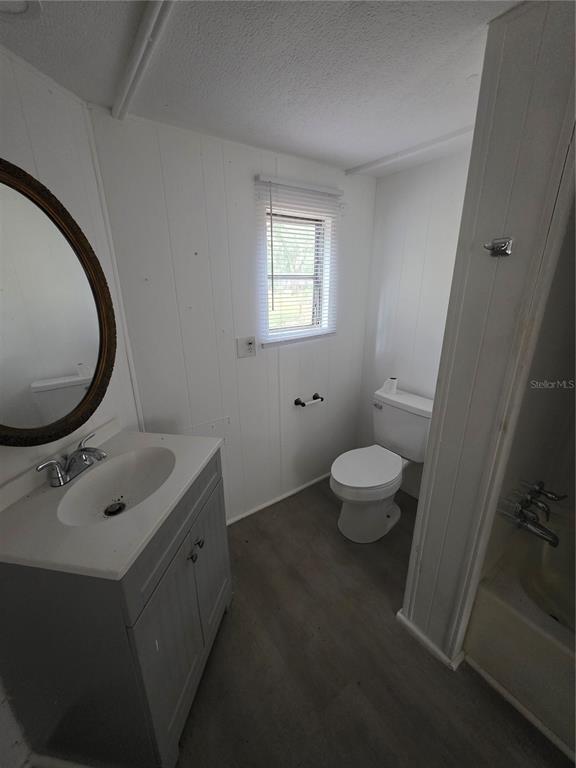 204 Johntry Road Hawthorne, FL 32640 - Photo 13 of 16 a bathroom with a sink toilet and a mirror