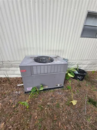 a wooden bench sitting in a backyard