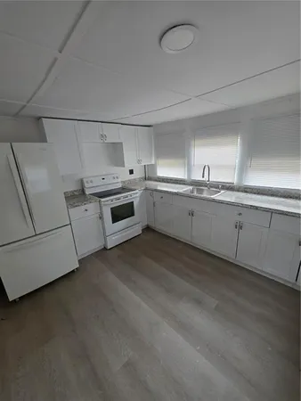 a kitchen that has a sink and a stove