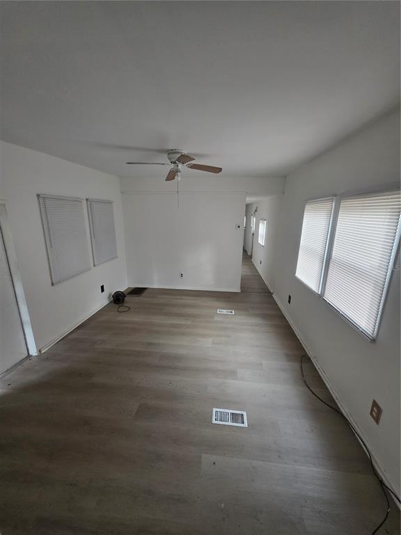 204 Johntry Road Hawthorne, FL 32640 - Photo 9 of 16 an empty room with wooden floor and windows