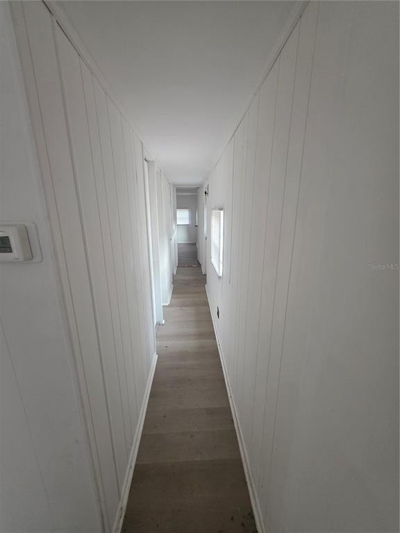 204 Johntry Road Hawthorne, FL 32640 - Photo 10 of 16 a view of a hallway with a wooden floor