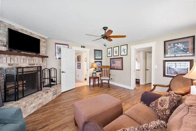 a bathroom with a granite countertop toilet sink and mirror