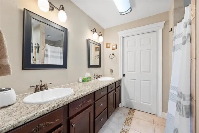 a bedroom with two beds and a window