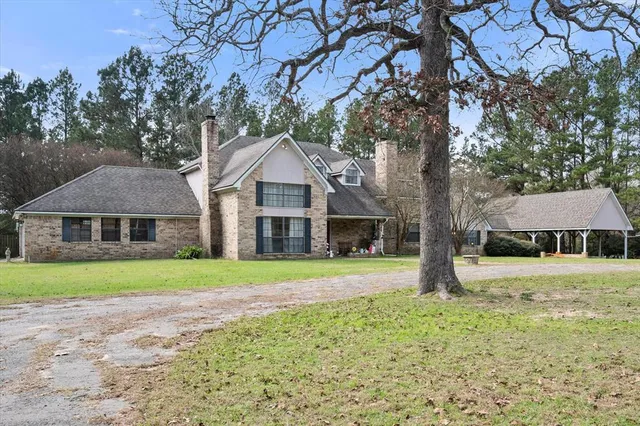 a couple of table and chairs sitting in the middle of a park