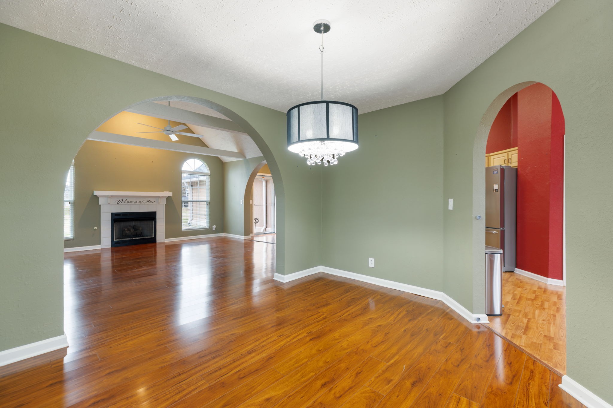 1240 Hunters Point Lane Spring Hill, TN 37174 - Photo 14 of 58 a view of empty room with wooden floor and fireplace