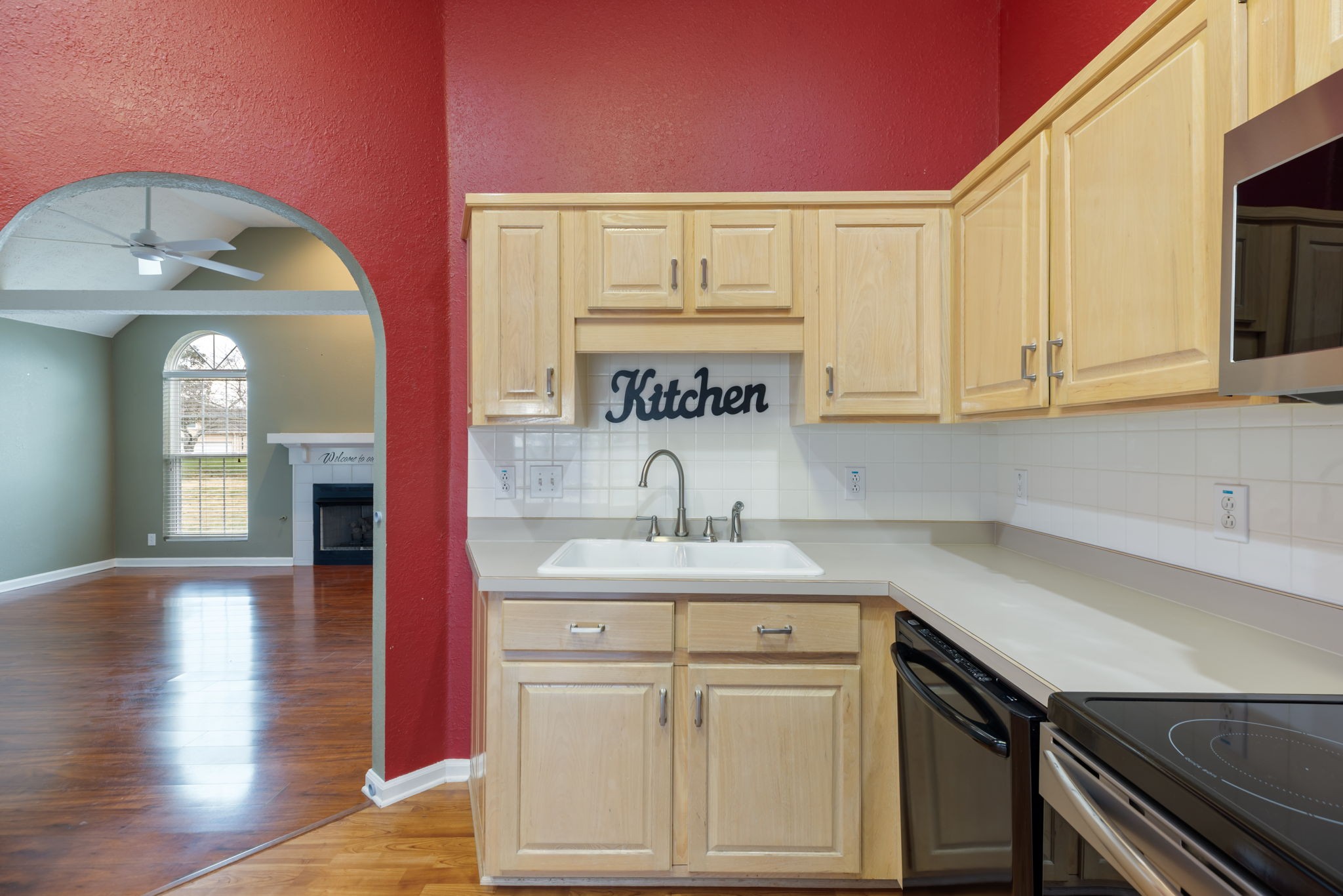 1240 Hunters Point Lane Spring Hill, TN 37174 - Photo 22 of 58 a kitchen with a sink cabinets and wooden floor