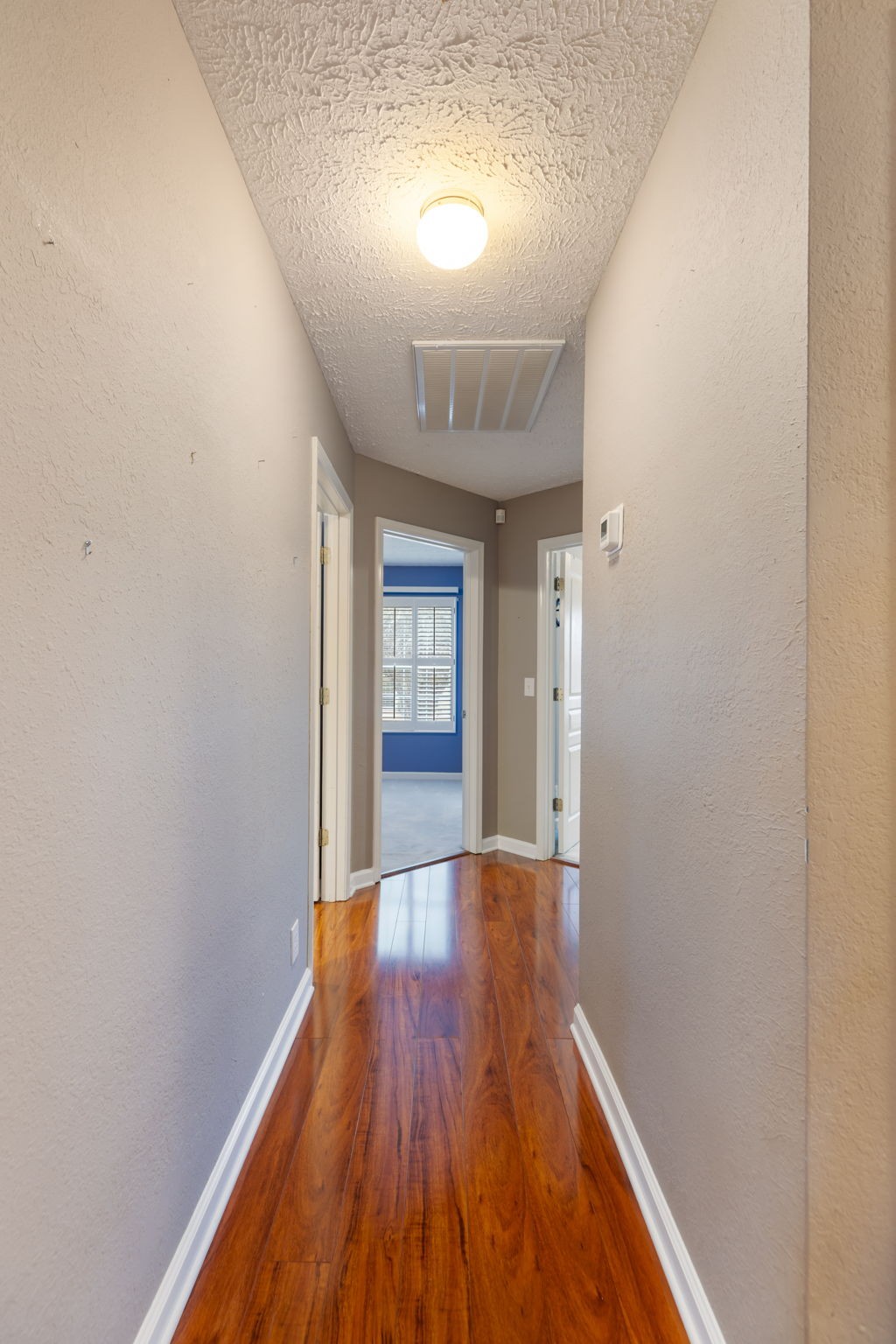 1240 Hunters Point Lane Spring Hill, TN 37174 - Photo 25 of 58 a view of a hallway with wooden floor