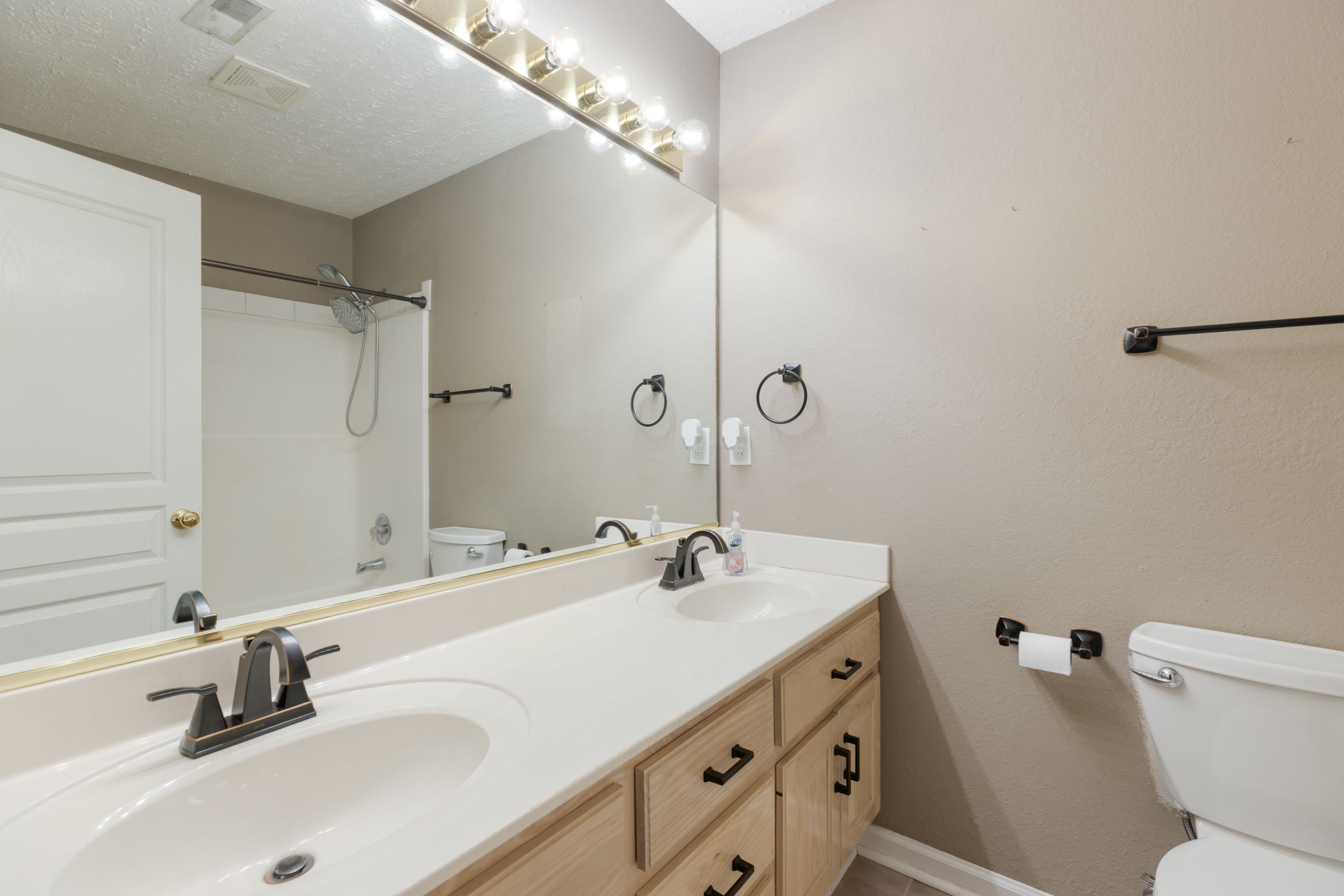 1240 Hunters Point Lane Spring Hill, TN 37174 - Photo 27 of 58 a bathroom with a sink and a mirror