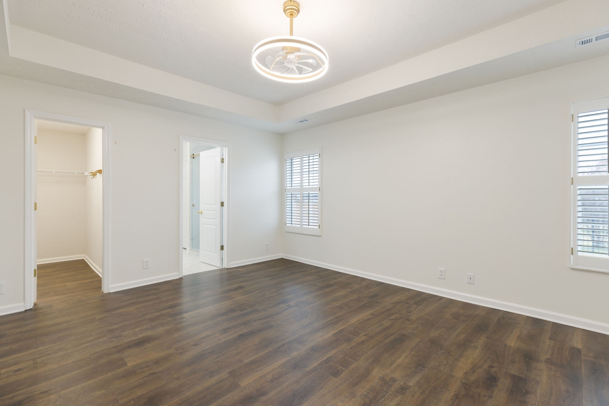 1240 Hunters Point Lane Spring Hill, TN 37174 - Photo 28 of 58 an empty room with wooden floor and windows