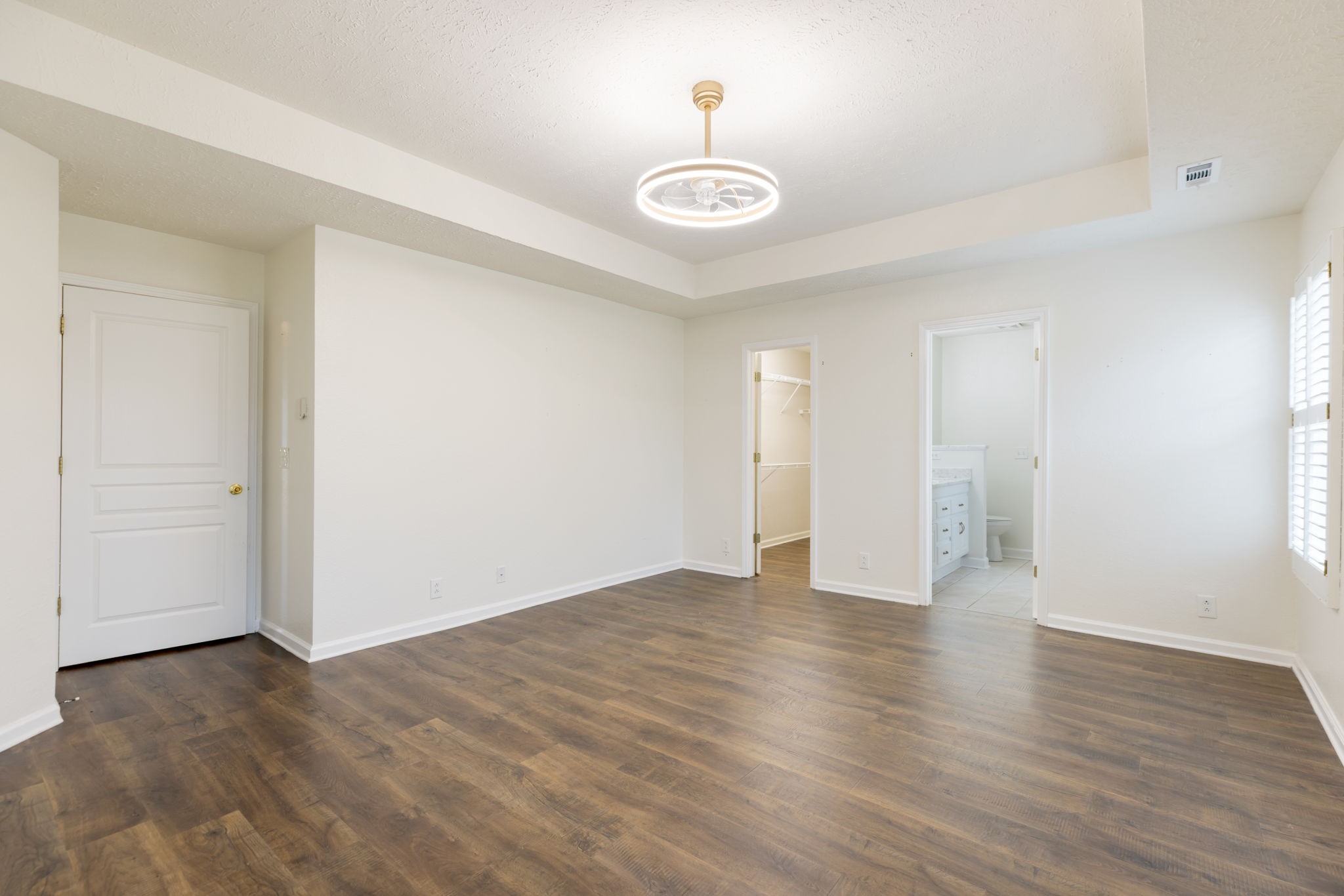 1240 Hunters Point Lane Spring Hill, TN 37174 - Photo 30 of 58 a view of an empty room with wooden floor and a window