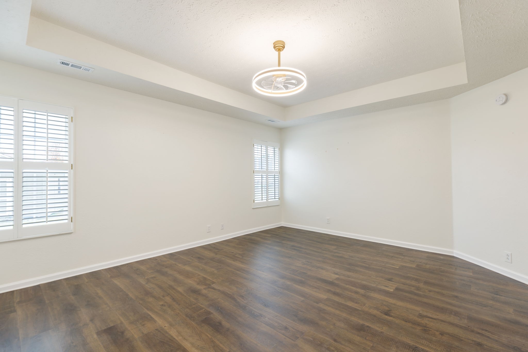 1240 Hunters Point Lane Spring Hill, TN 37174 - Photo 32 of 58 an empty room with wooden floor and windows
