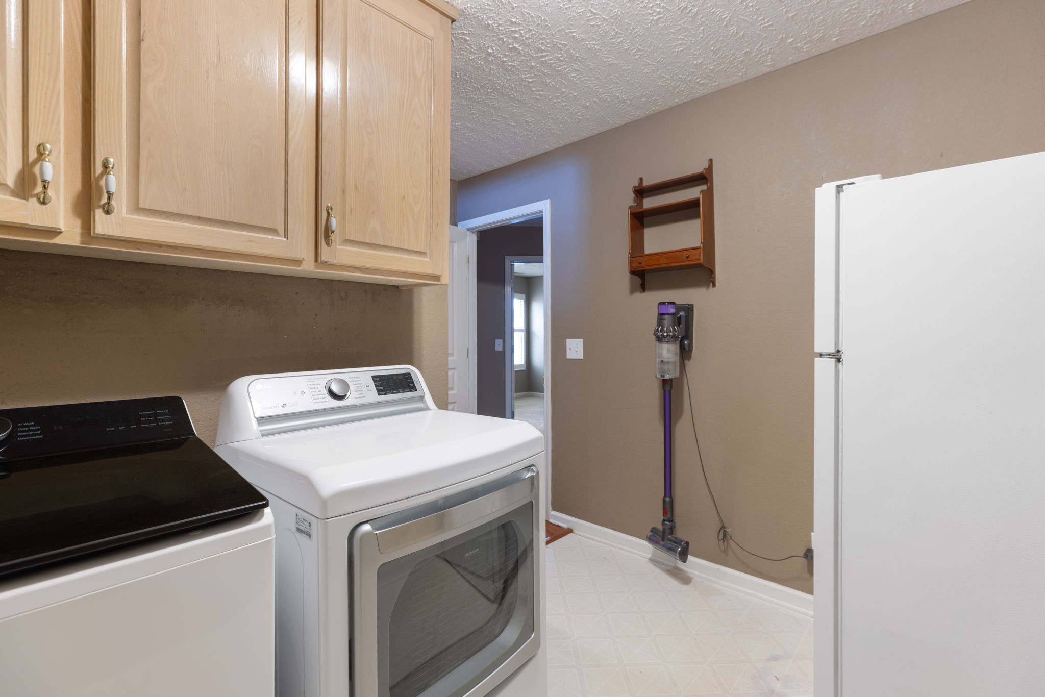 1240 Hunters Point Lane Spring Hill, TN 37174 - Photo 40 of 58 a utility room with dryer and washer