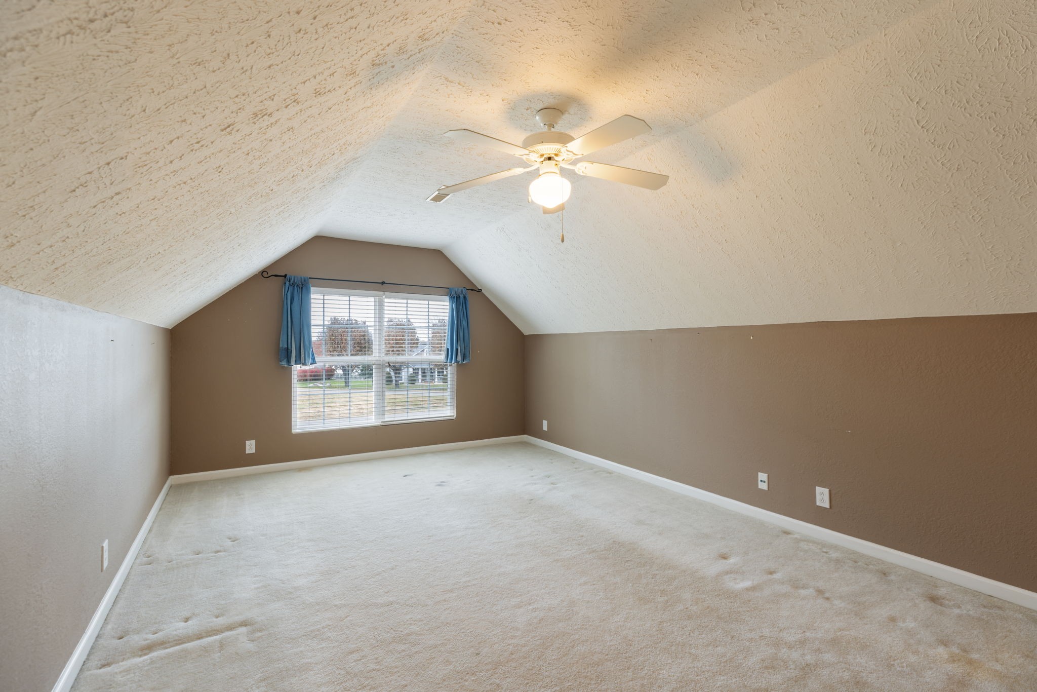 1240 Hunters Point Lane Spring Hill, TN 37174 - Photo 43 of 58 an empty room with a chandelier fan and windows