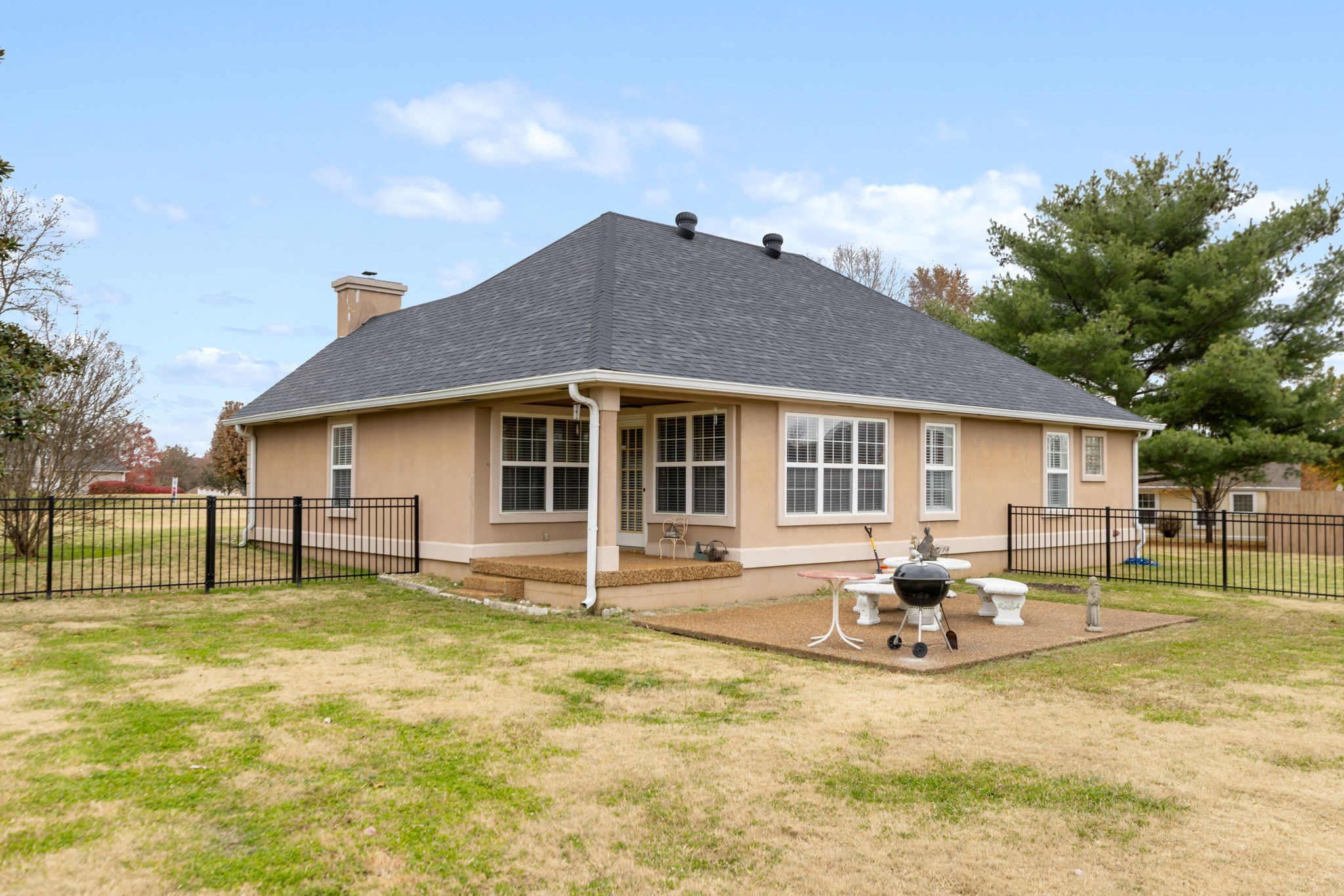 1240 Hunters Point Lane Spring Hill, TN 37174 - Photo 48 of 58 a backyard of a house with table and chairs
