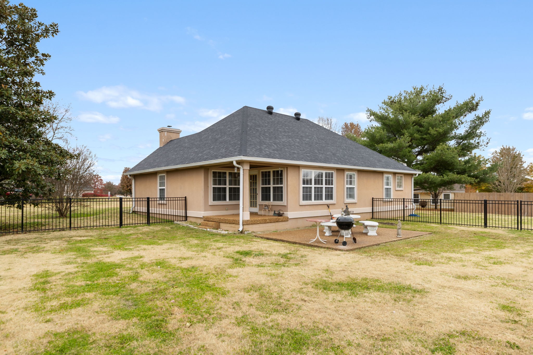 1240 Hunters Point Lane Spring Hill, TN 37174 - Photo 49 of 58 a backyard of a house with garden and patio