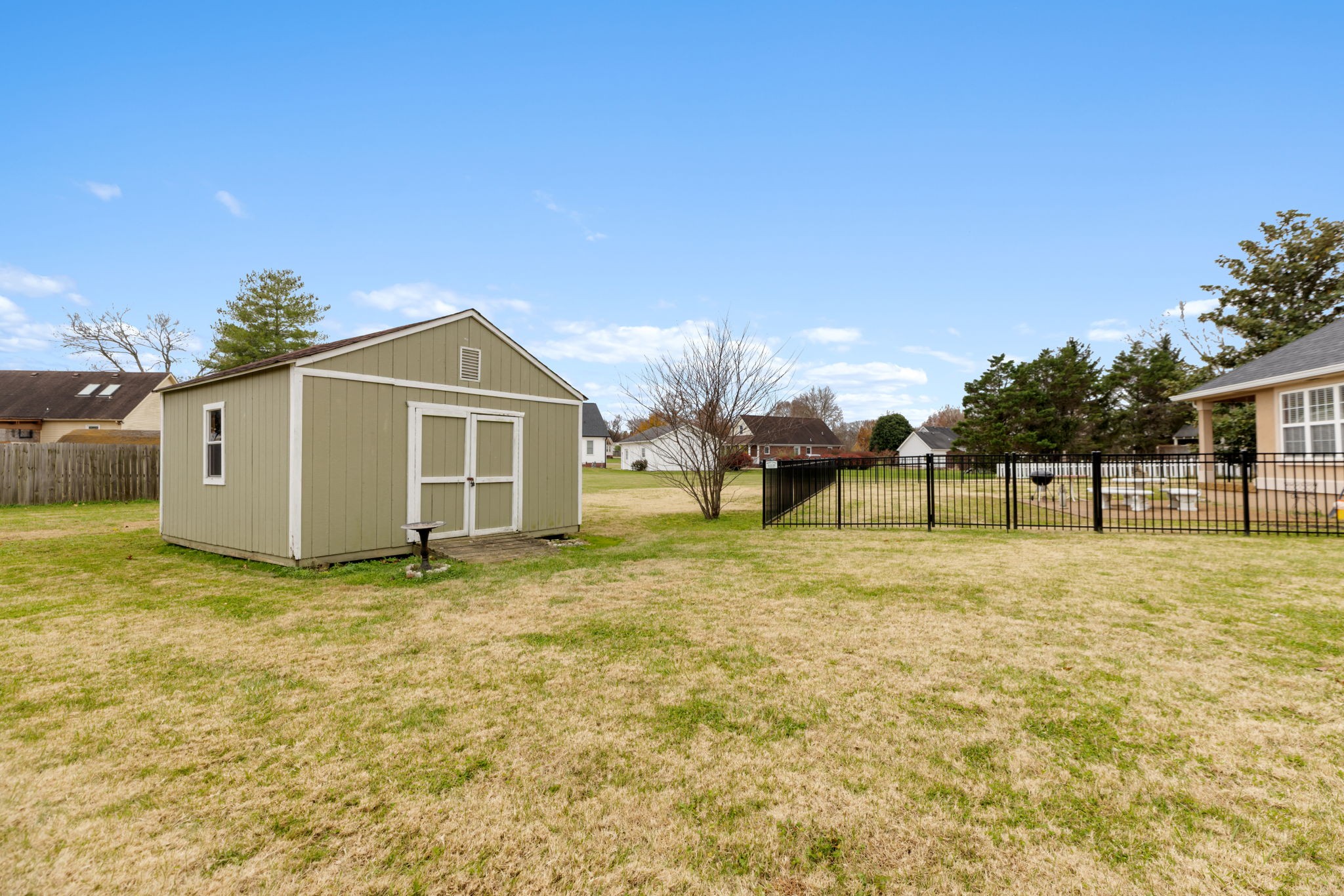 1240 Hunters Point Lane Spring Hill, TN 37174 - Photo 56 of 58 a view of a yard in front of a house with a garage