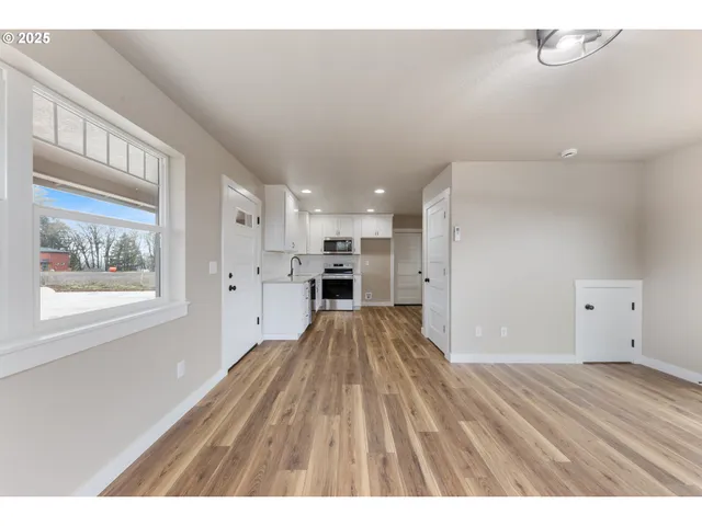 a view of kitchen with wooden floor
