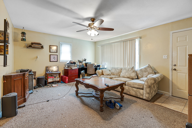 81-83 Eagle Point Road Fox Lake, IL 60020 - Photo 13 of 23 a living room with furniture and a large window