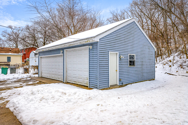 81-83 Eagle Point Road Fox Lake, IL 60020 - Photo 20 of 23 a view of a house with a yard covered in snow