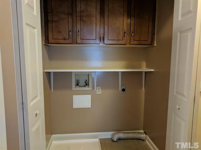 a view of door with washer and dryer