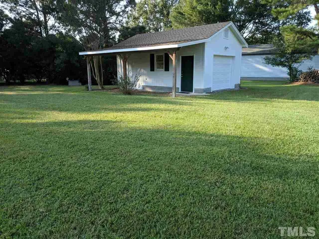a view of a yard in front of house