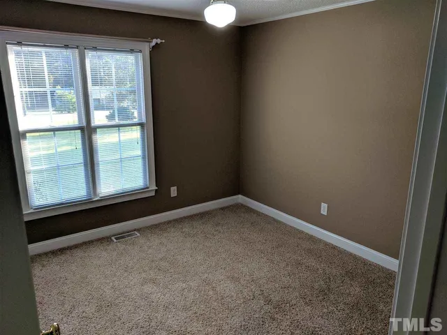 a view of a window in an empty room