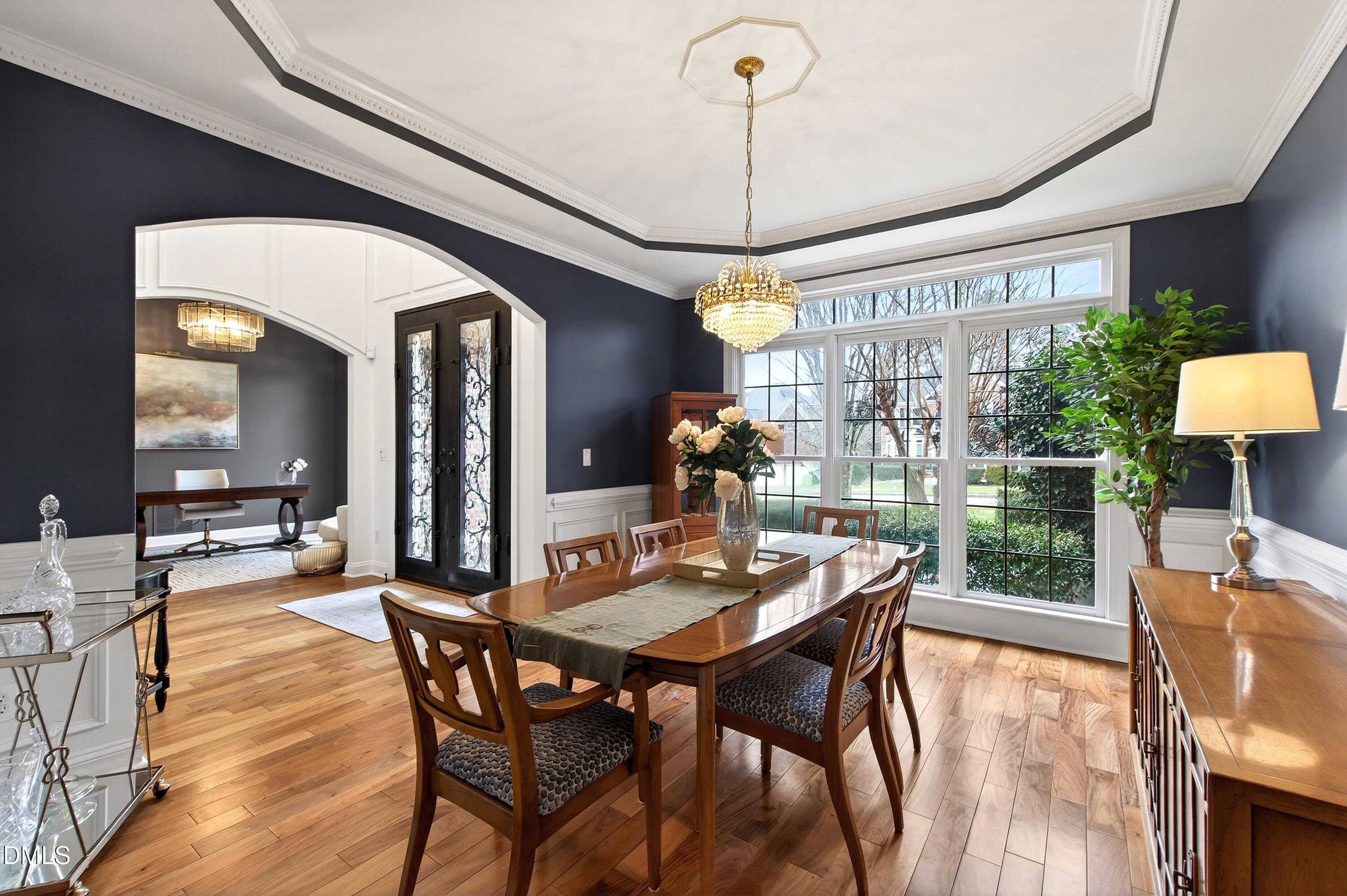 12325 Camberwell Court Raleigh, NC 27614 - Photo 11 of 76 a view of a dining room and livingroom with furniture wooden floor a chandelier