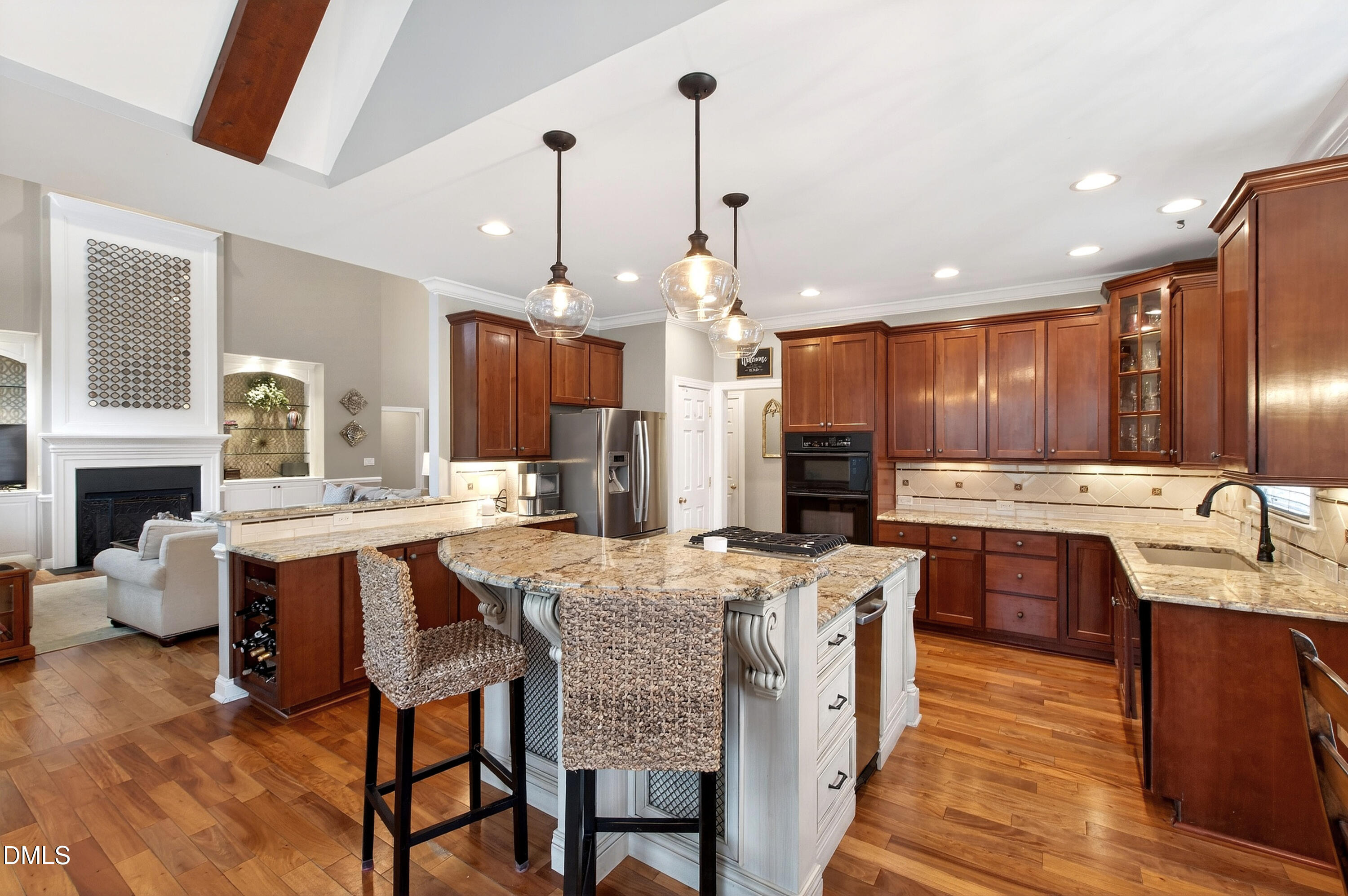 12325 Camberwell Court Raleigh, NC 27614 - Photo 20 of 76 a large kitchen with kitchen island a sink table and chairs