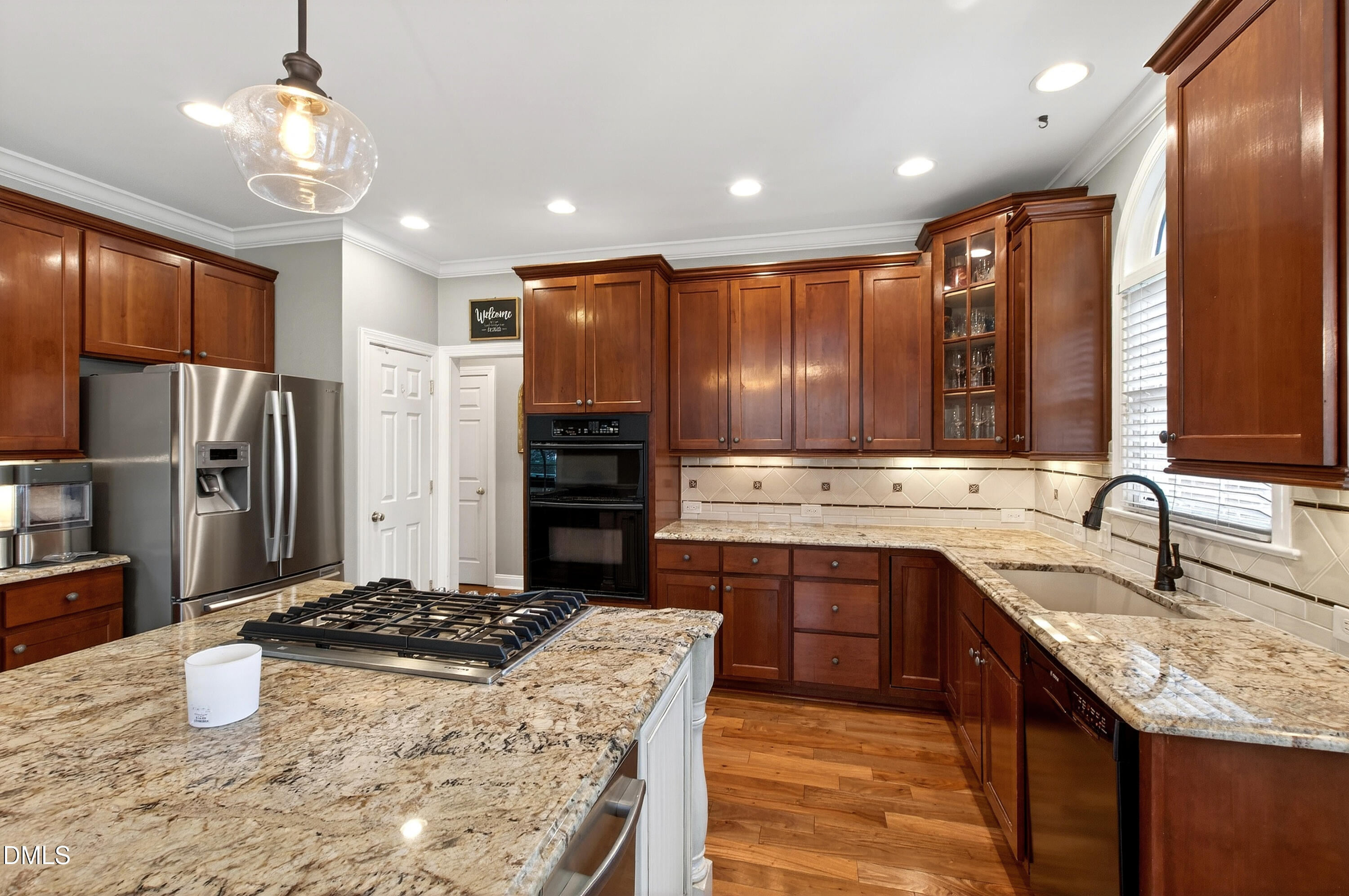 12325 Camberwell Court Raleigh, NC 27614 - Photo 21 of 76 a kitchen with stainless steel appliances granite countertop a sink stove and refrigerator