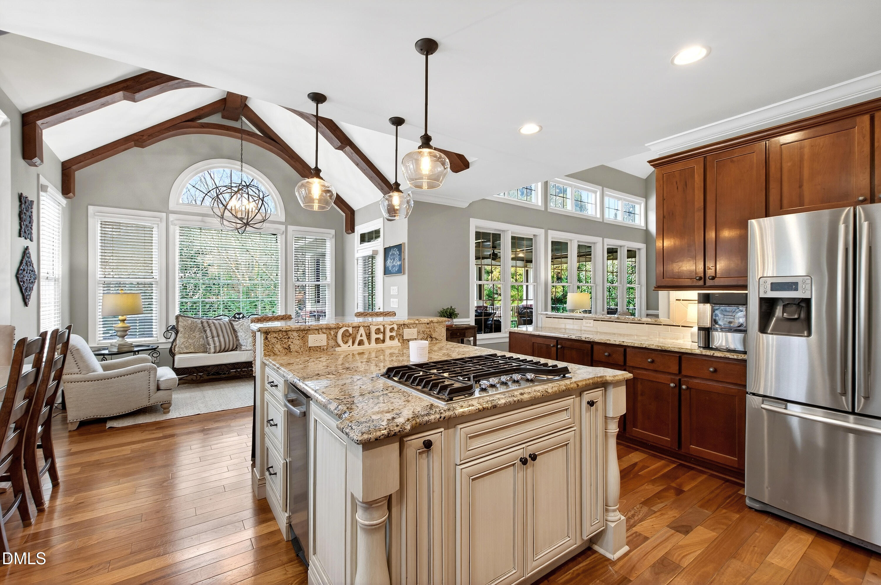 12325 Camberwell Court Raleigh, NC 27614 - Photo 22 of 76 a kitchen with stainless steel appliances granite countertop a stove a refrigerator a sink dishwasher and white cabinets with wooden floor