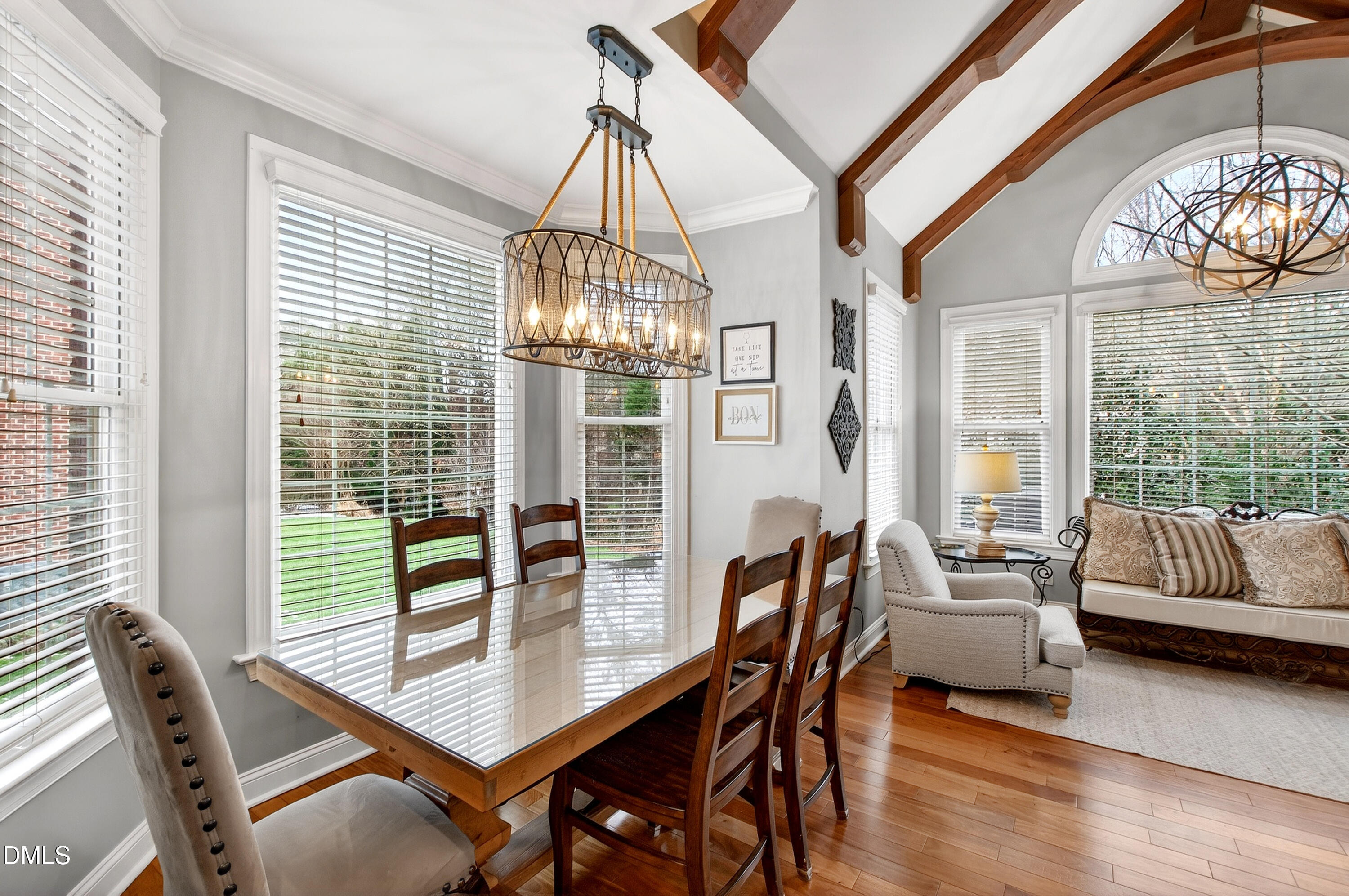 12325 Camberwell Court Raleigh, NC 27614 - Photo 26 of 76 a dining room with furniture a chandelier and wooden floor