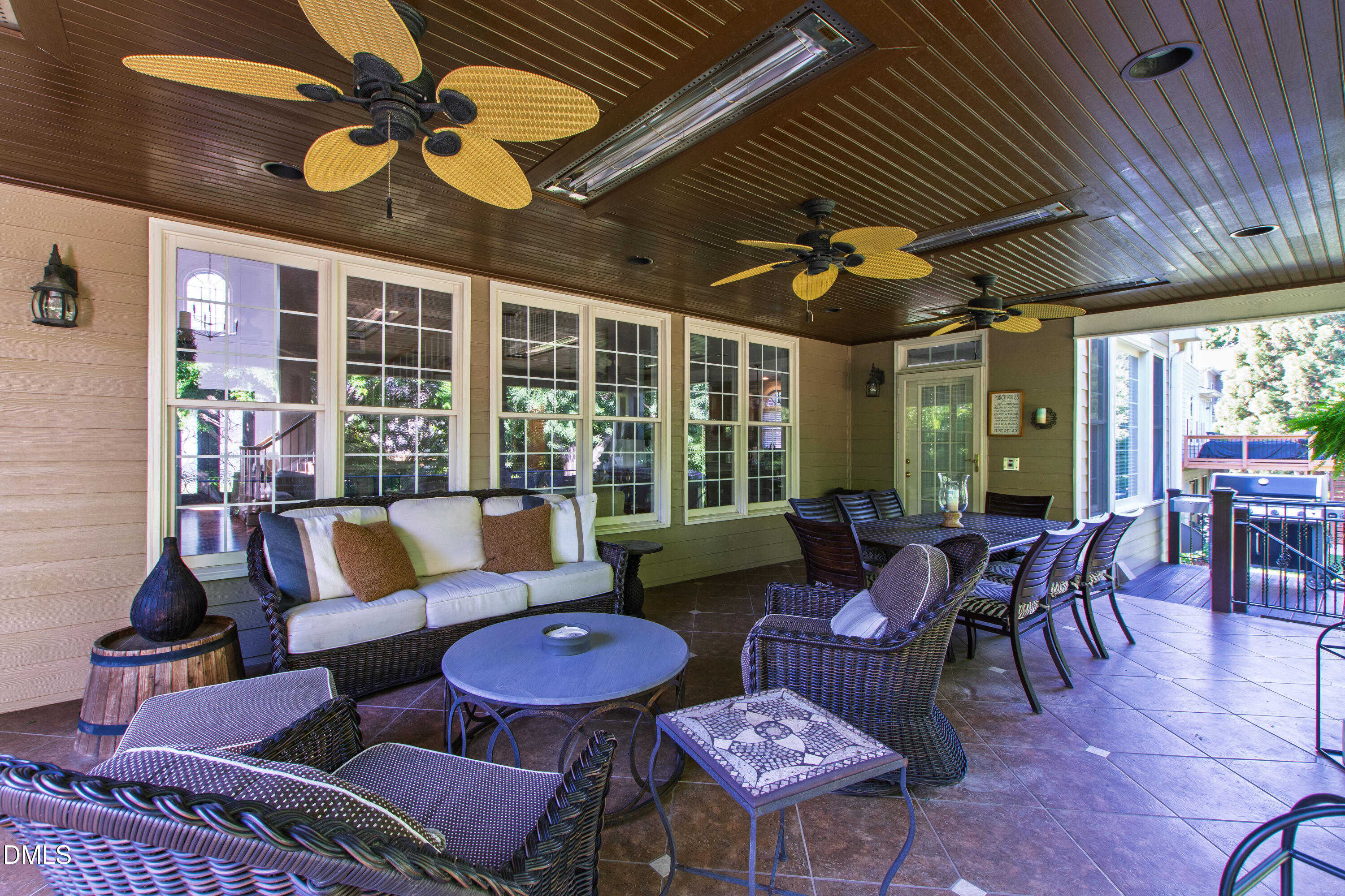 12325 Camberwell Court Raleigh, NC 27614 - Photo 31 of 76 a living room with furniture a chandelier and a large window