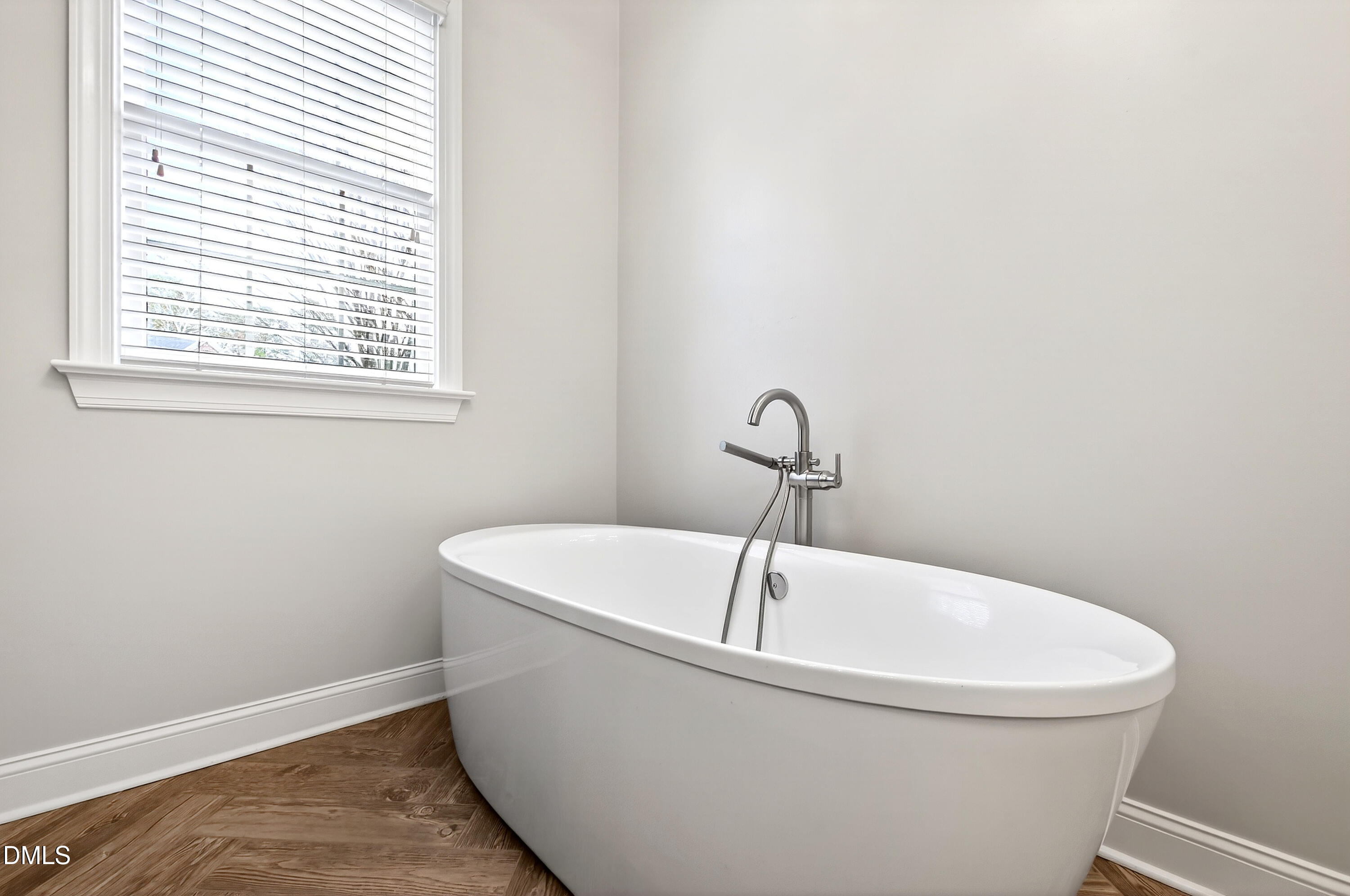 12325 Camberwell Court Raleigh, NC 27614 - Photo 35 of 76 a white bath tub sitting in a bathroom