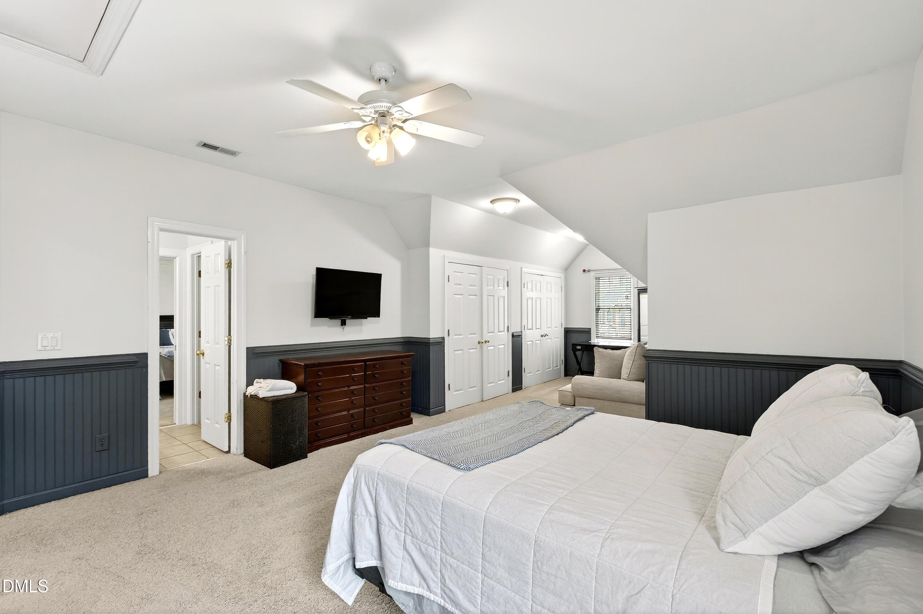 12325 Camberwell Court Raleigh, NC 27614 - Photo 40 of 76 a bedroom with a bed and a flat screen tv