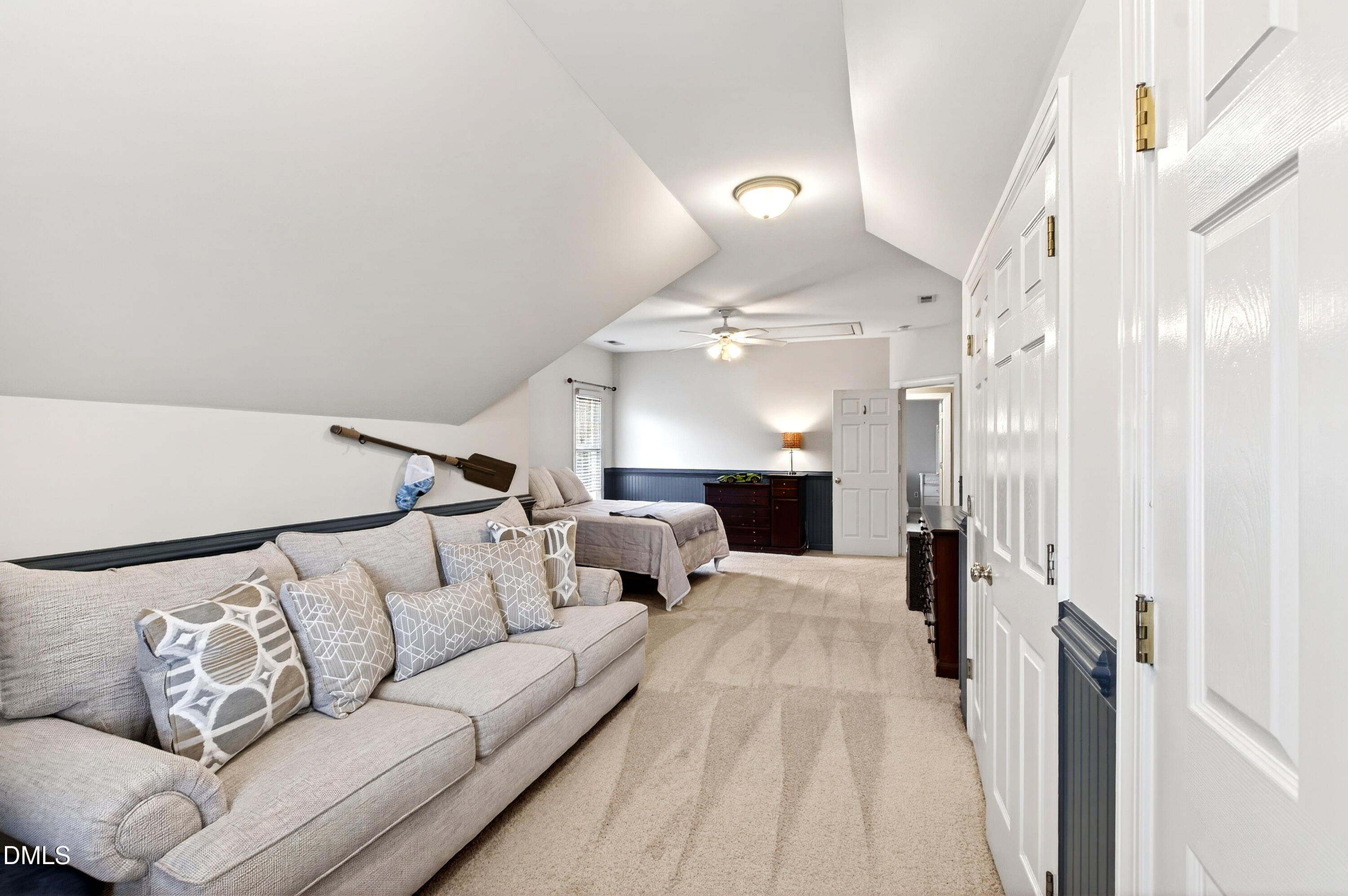 12325 Camberwell Court Raleigh, NC 27614 - Photo 41 of 76 a living room with furniture and a chandelier