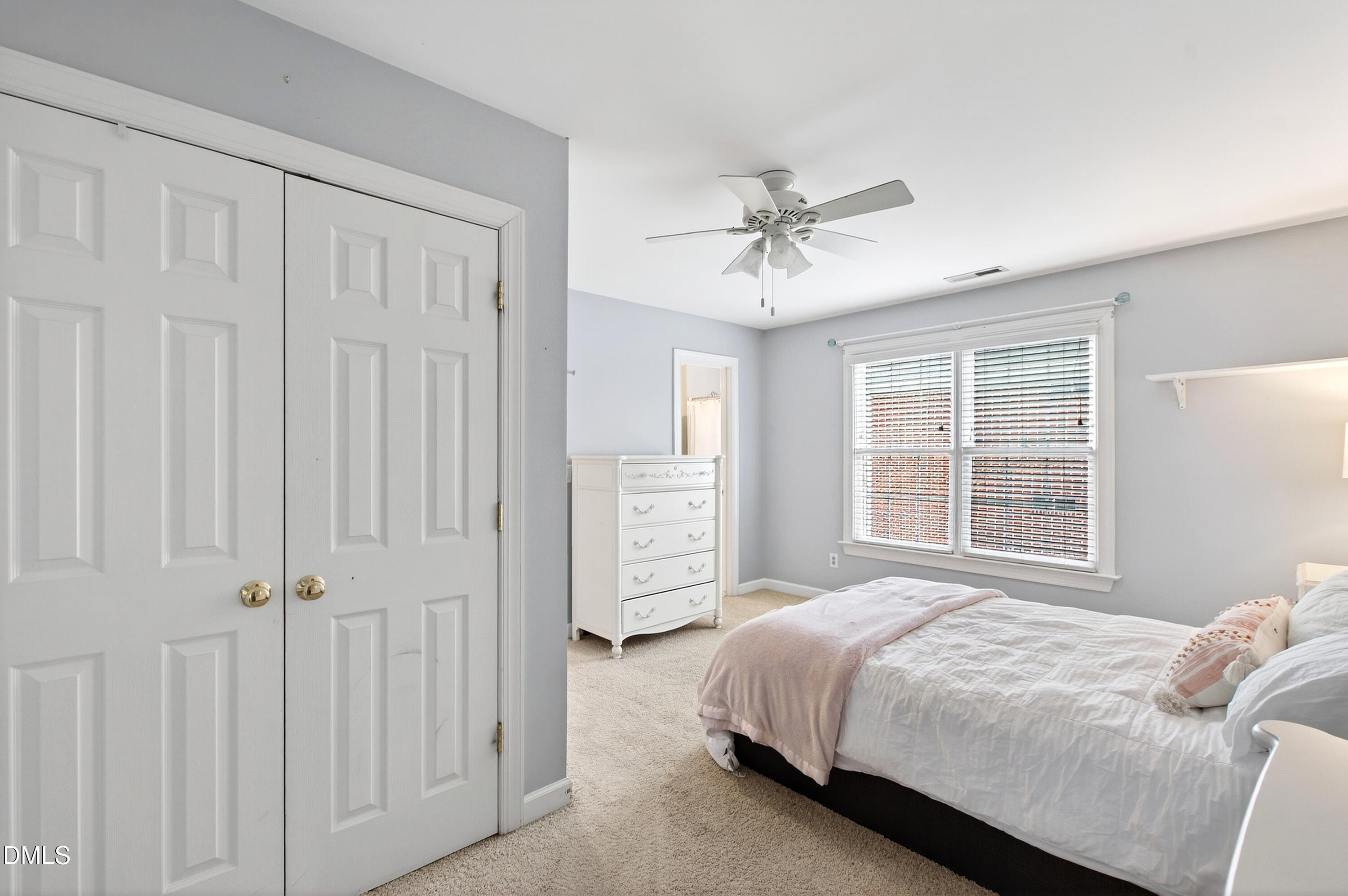 12325 Camberwell Court Raleigh, NC 27614 - Photo 47 of 76 a bedroom with a large bed and a window