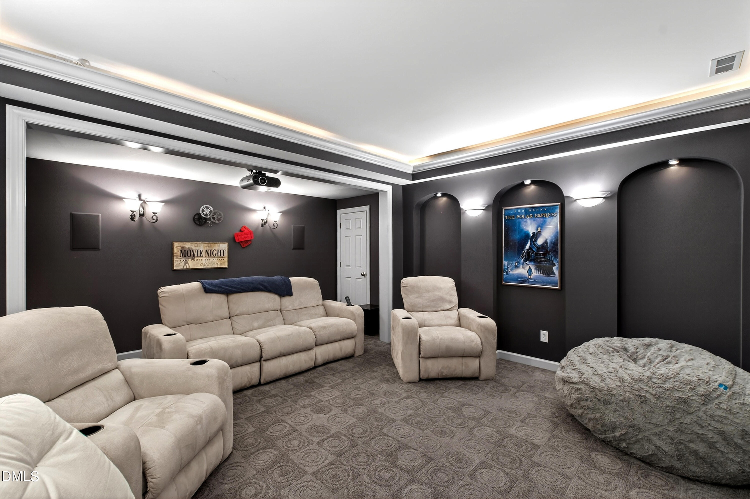 12325 Camberwell Court Raleigh, NC 27614 - Photo 58 of 76 a living room with furniture and a projector