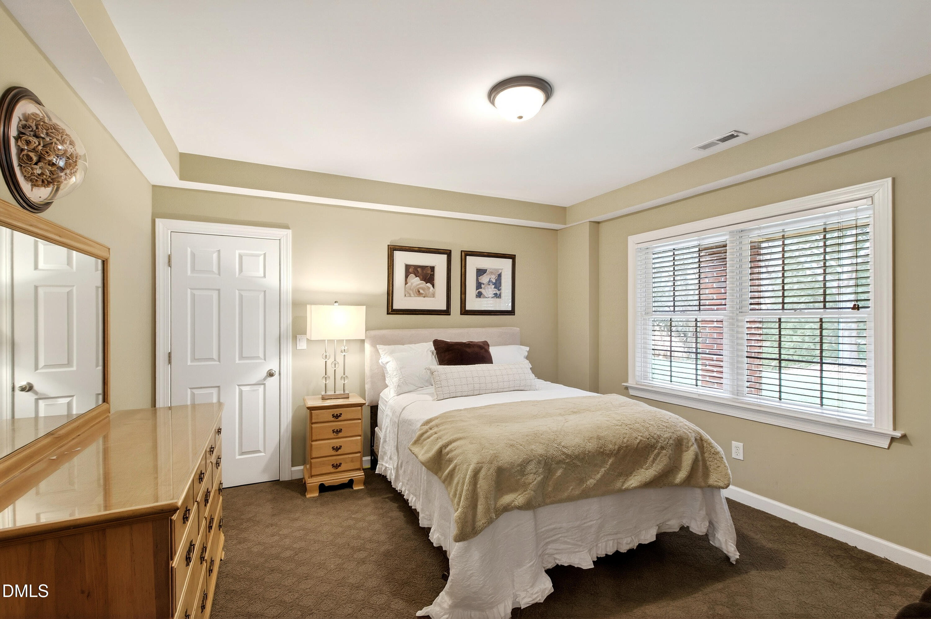 12325 Camberwell Court Raleigh, NC 27614 - Photo 59 of 76 a bedroom with a bed and a window