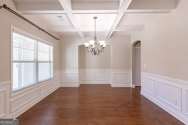 a kitchen with a refrigerator and a sink