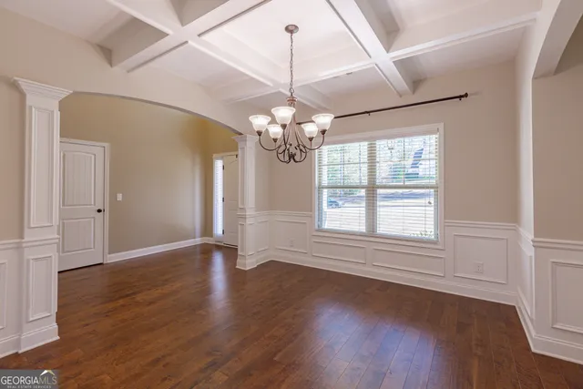 a view of livingroom with furniture window wooden floor and front door