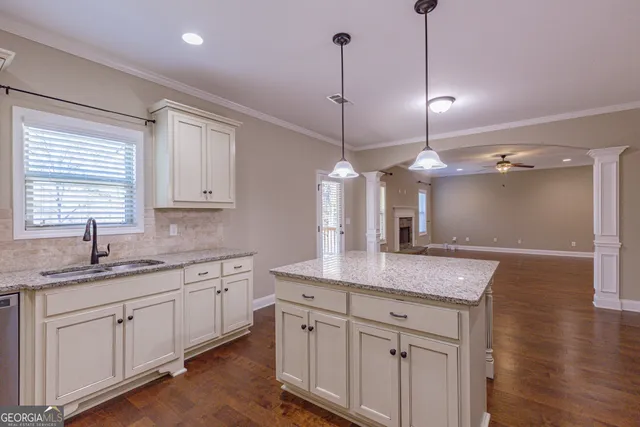 a bathroom with a granite countertop sink mirror and double