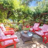 a building outdoor space with patio furniture and potted plants