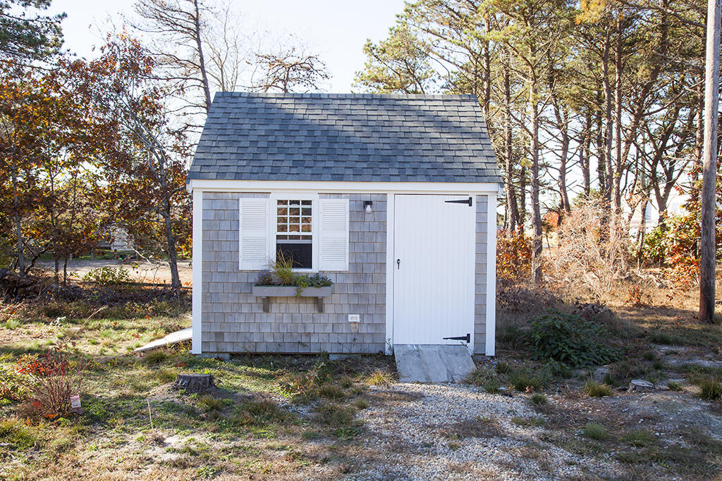 7 Arrowhead Road Truro, MA 02666 - Photo 5 of 21 a view of a house with a yard
