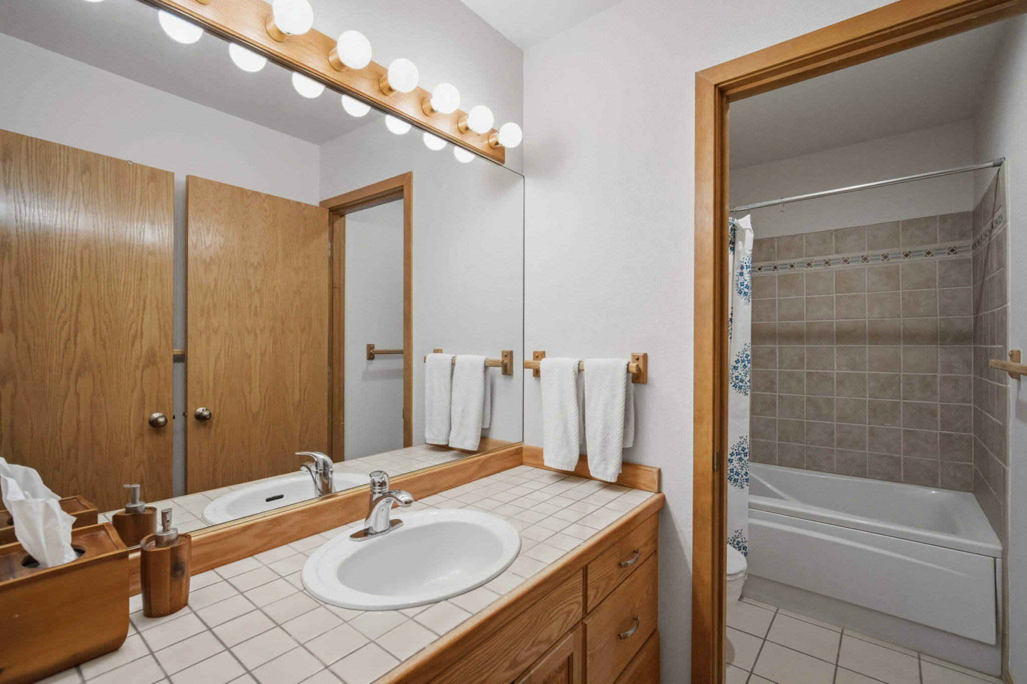 17682 Bittern Lane, Unit 31 Sunriver, OR 97707 - Photo 31 of 44 a bathroom with a granite countertop sink and a mirror