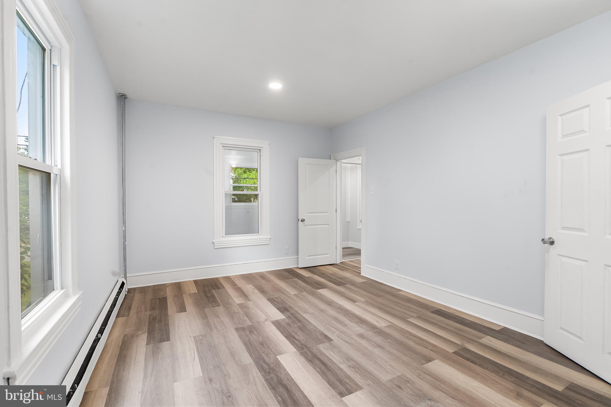 131 West Clinton Street Clayton, NJ 08312 - Photo 13 of 41 a view of room with window and hardwood floor