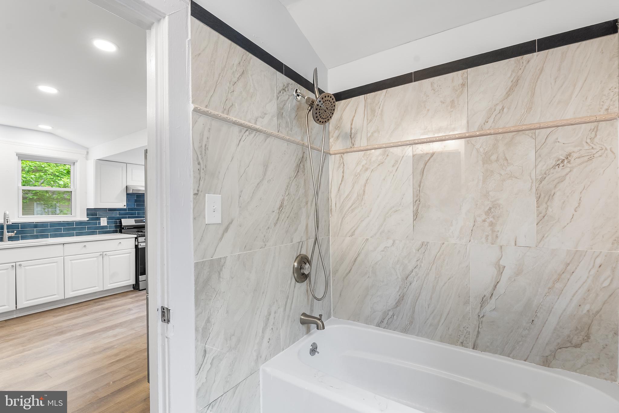 131 West Clinton Street Clayton, NJ 08312 - Photo 19 of 41 a bathroom with a bathtub and a shower