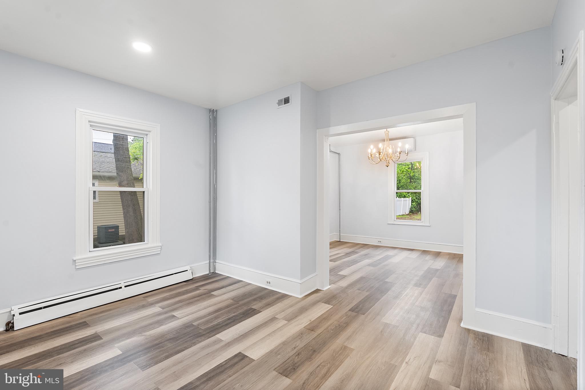 131 West Clinton Street Clayton, NJ 08312 - Photo 22 of 41 an empty room with windows and entrance