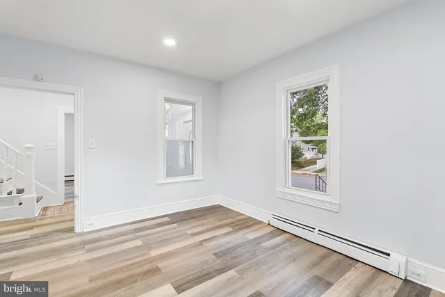 a bathroom with a sink a mirror and shower